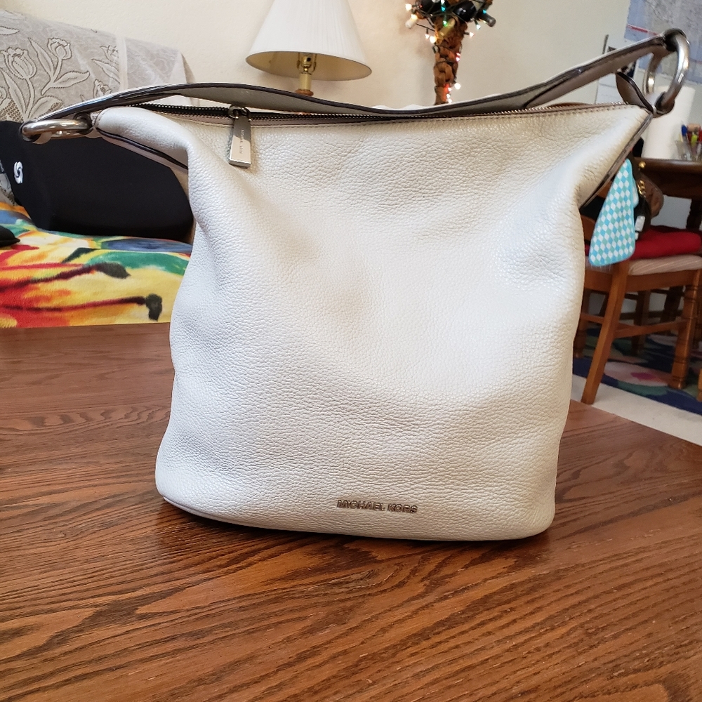 Michael Kors beige color soft leather handbag.
